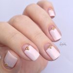 07-a-girlish-take-on-French-nails-with-a-large-creamy-tip-and-little-rhinestones-for-a-chic-look